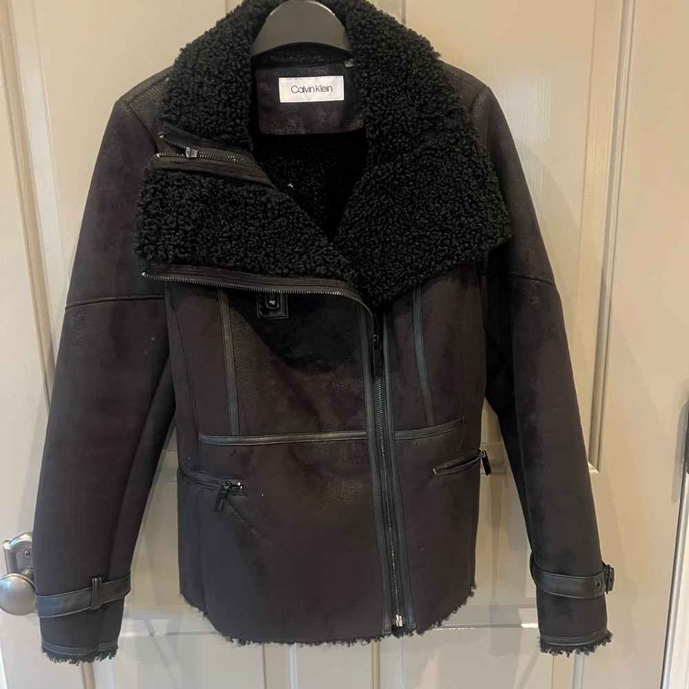 Black faux shearling zip jacket.